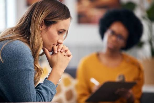 Woman reflecting during a supportive therapy session
