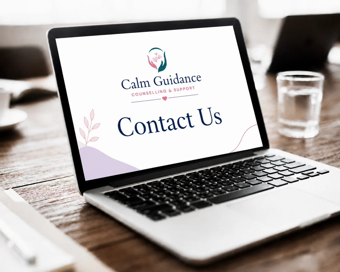 Calm Guidance Counselling contact page displayed on a laptop
