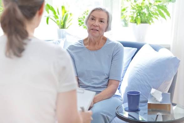 Senior resident speaking privately with a counsellor
