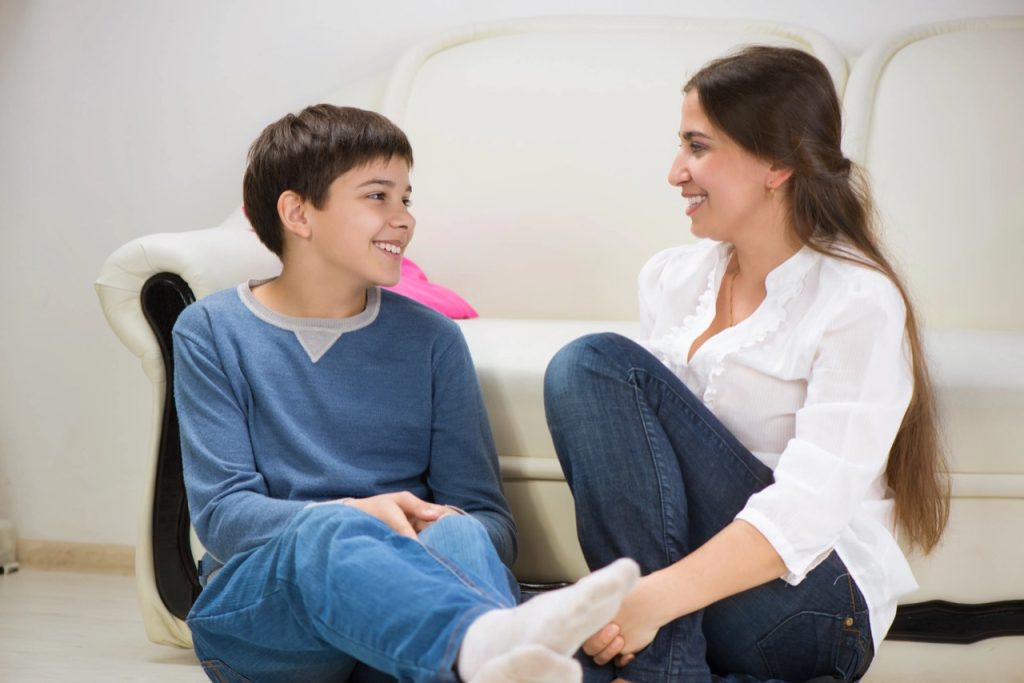 Parent and child talking calmly about school avoidance and emotional support