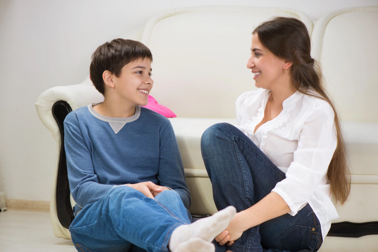 A parent and child in a calm conversation