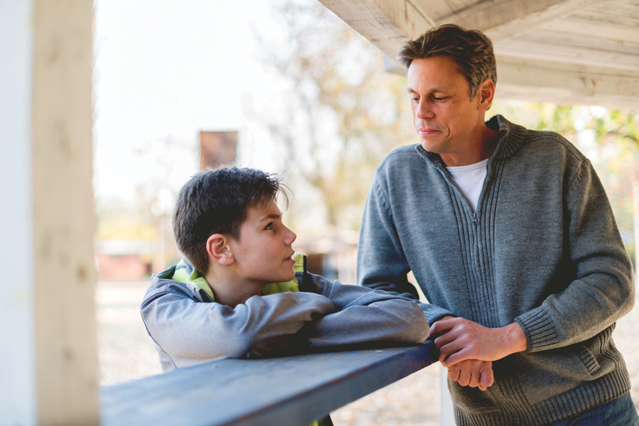 A parent listening to a child during a supportive conversation
